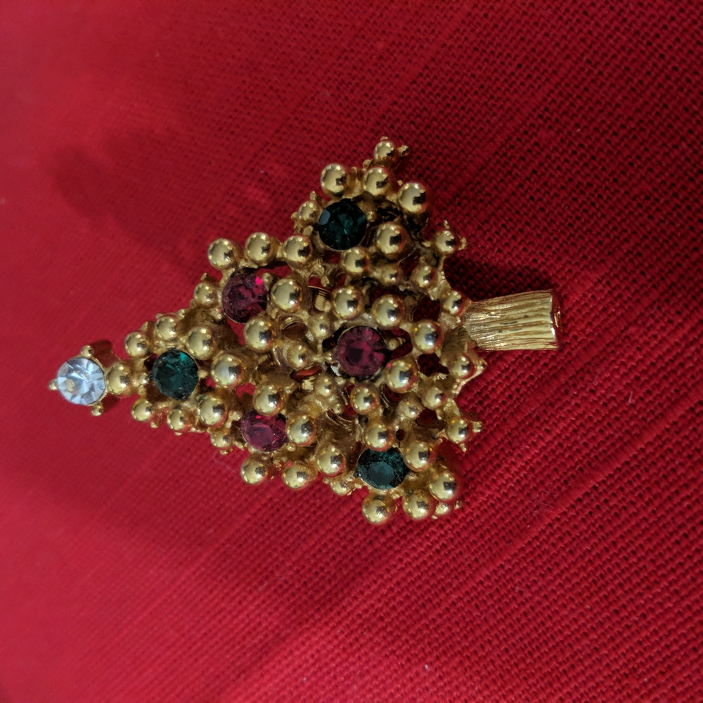 Gold color metal  Christmas tree brooch with red green and white stone